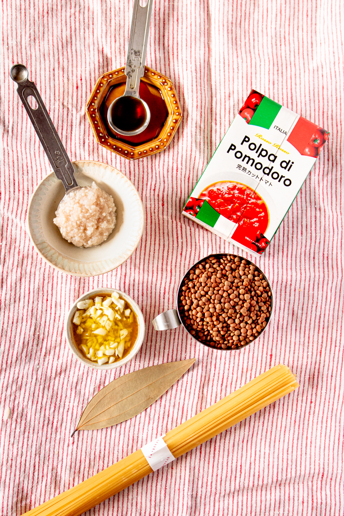 Soy sauce, onion koji, garlic, olive oil, lentils, pasta, canned tomatoes, bay leaf