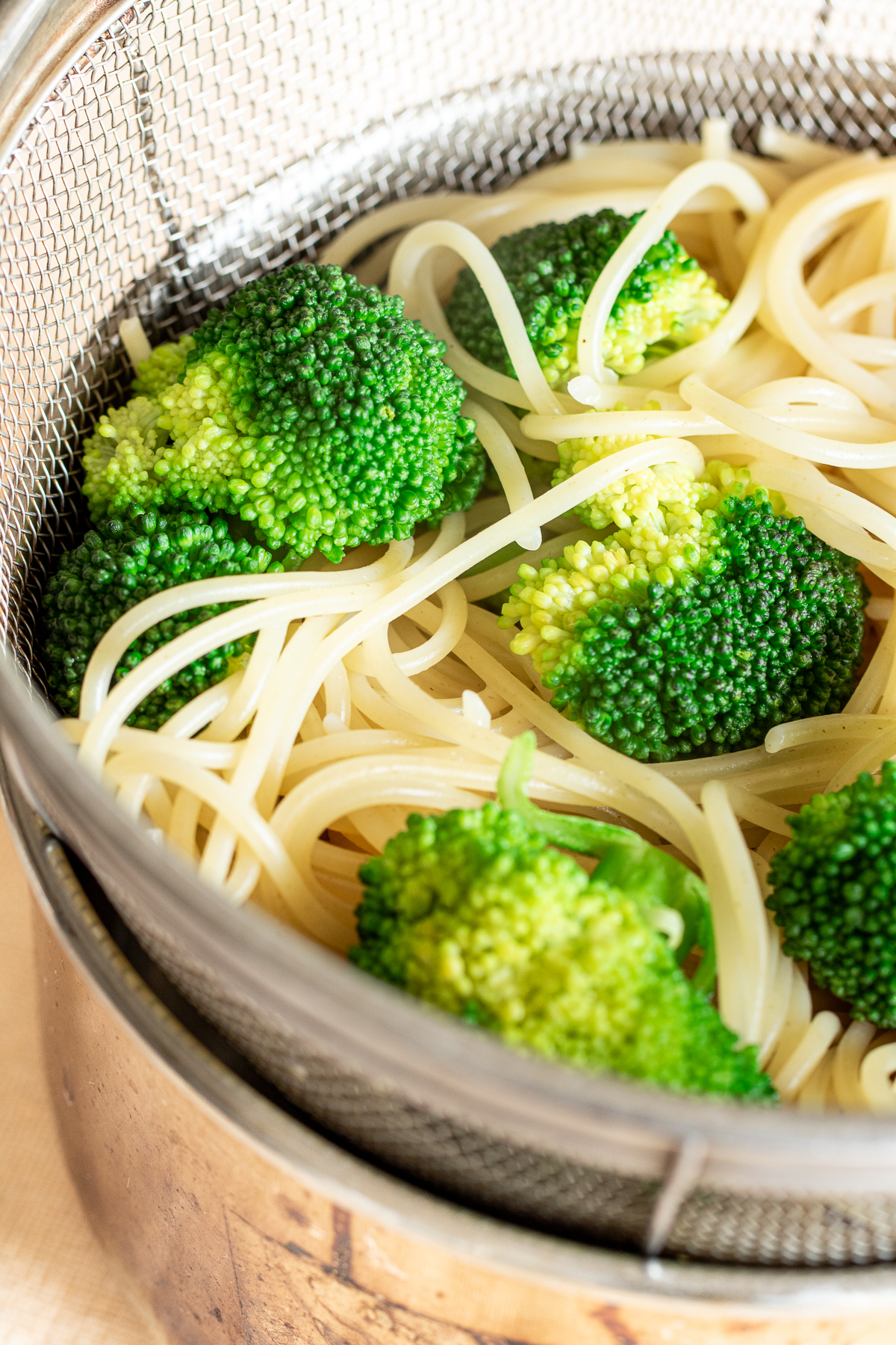 Cook pasta and broccoli together and drain in a colander.