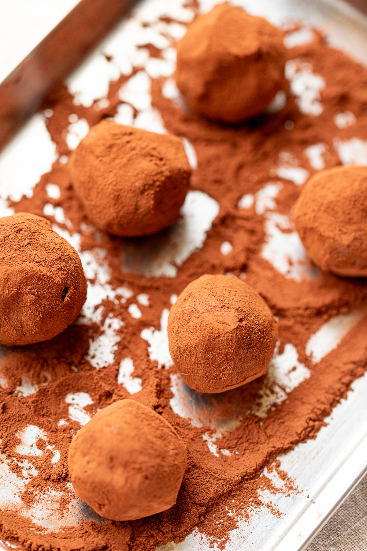 Finished vegan nama chocolate truffles coated in cocoa powder