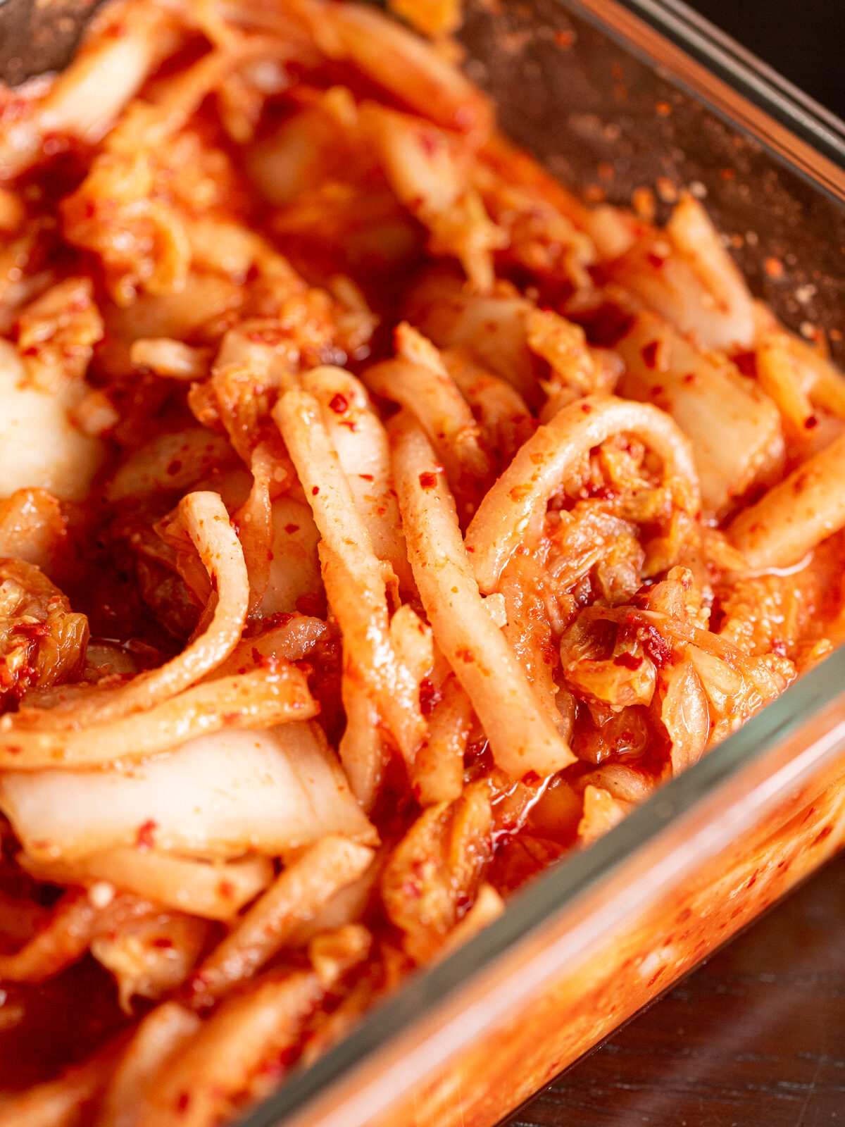 Vegan kimchi packed into a storage container