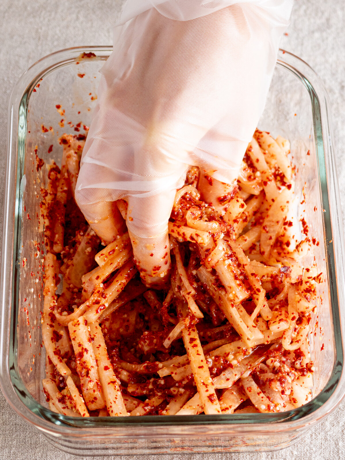 Daikon mixed with seasonings to make yangnyeom for vegan kimchi