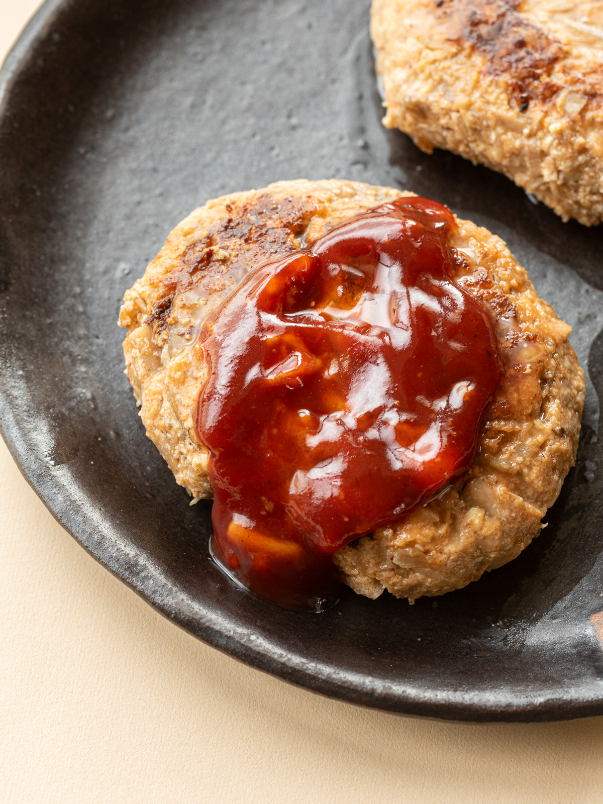 Vegan hamburger steak with lots of sauce