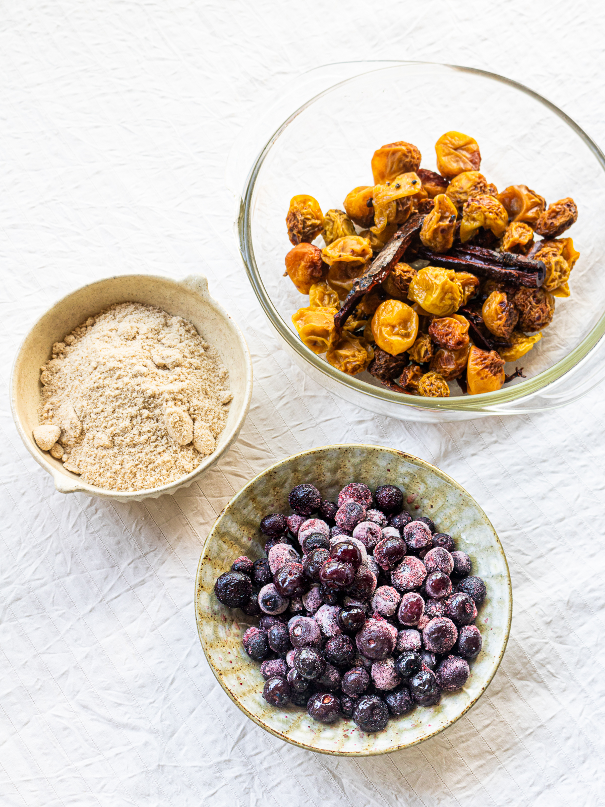 Leftover plums  from plum syrup and blueberries, sugar