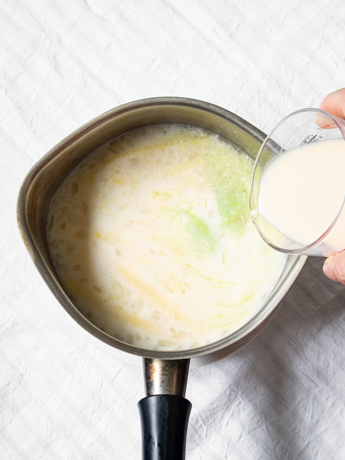 Chilled baby corn soup with soy milk added as a finishing touch
