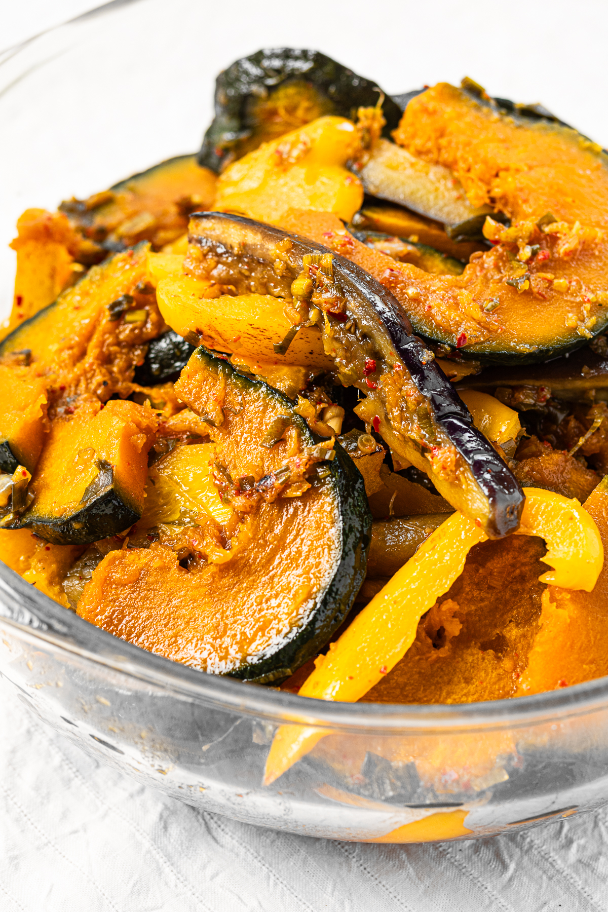 Close-up of vegan yakibitashi—eggplant, squash, and bell peppers marinated in a spicy soy-based sauce