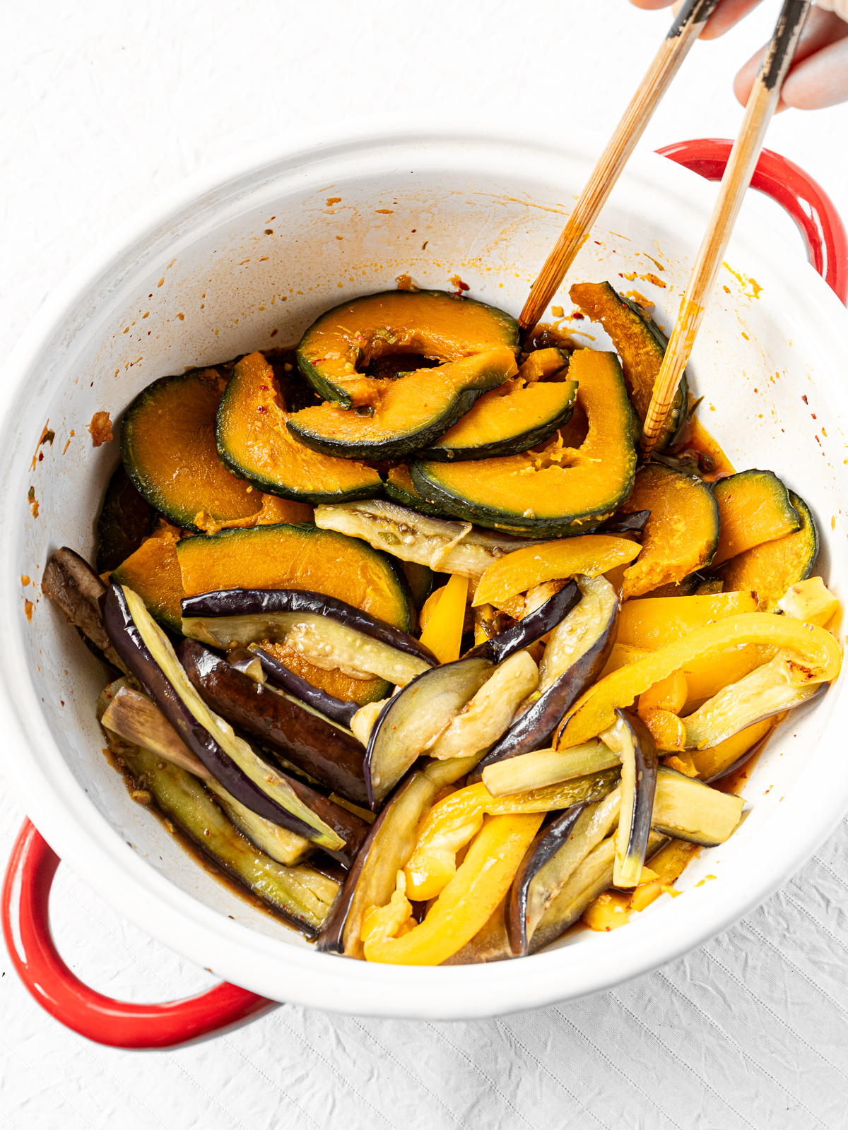Roasted vegetables mixed with spicy yakibitashi marinade in a pot