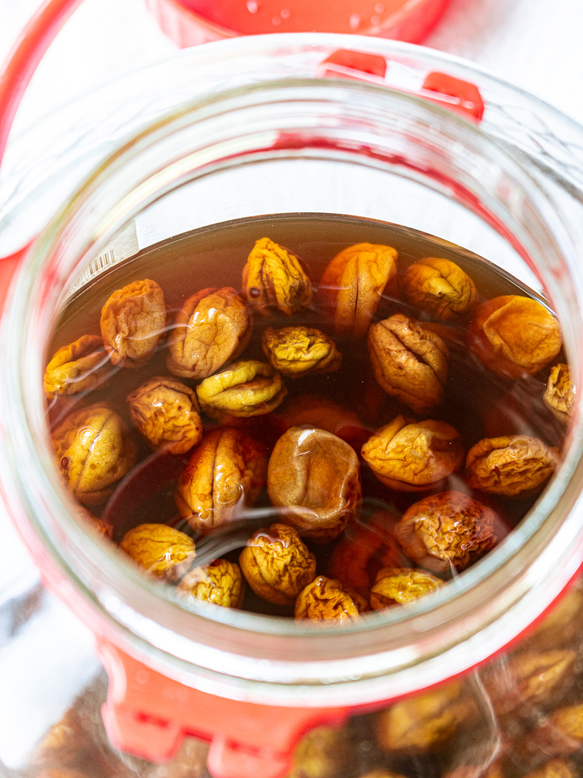 Finished Korean plum extract(Korean green plum syrup)
in a storage jar