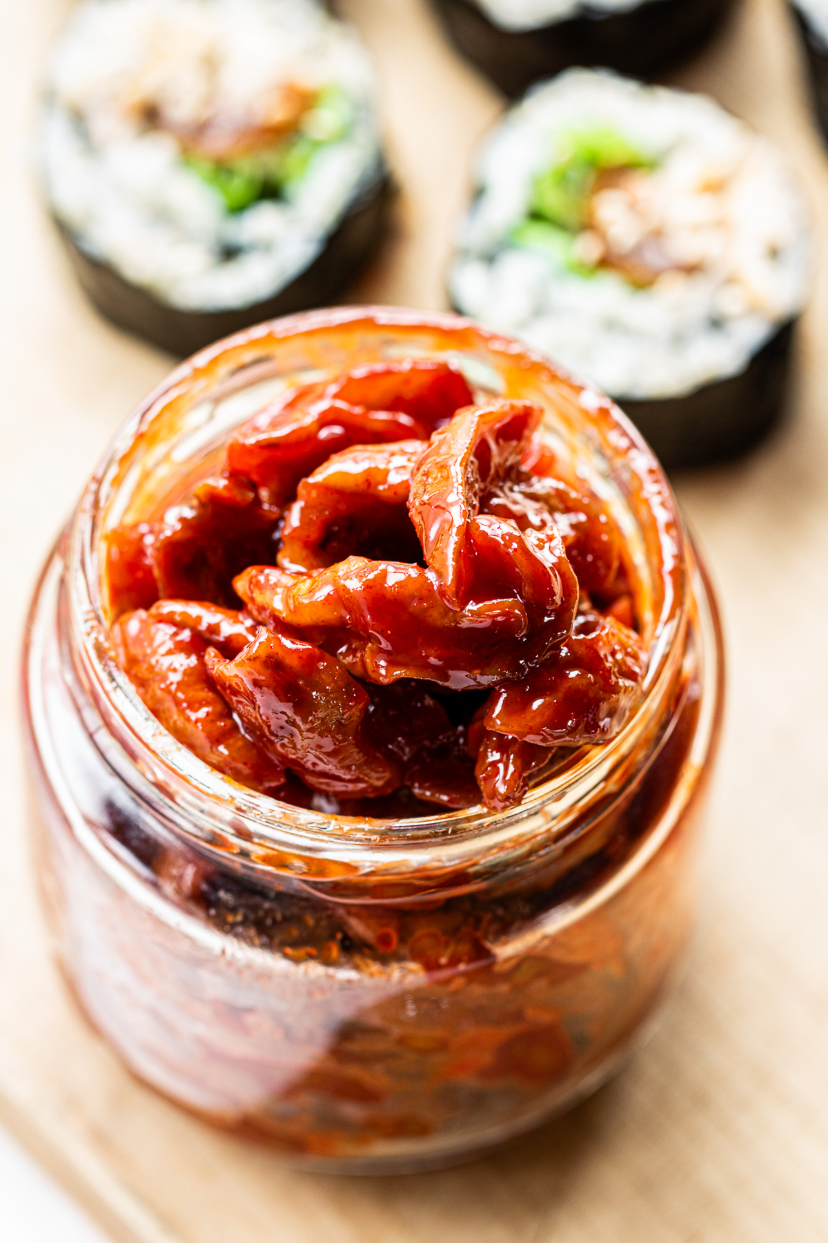 Maesil jangajji (pickled Korean plums) stored in a glass jar