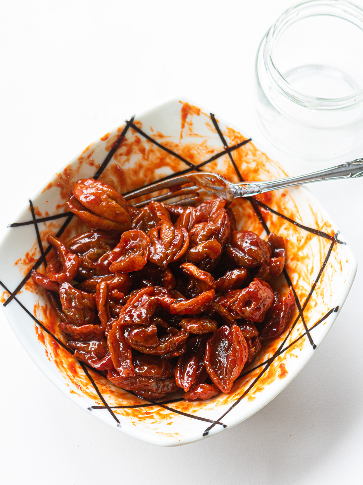 Leftover maesil plums mixed with gochujang in a bowl