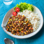 Easy vegan stir fry with colorful vegetables and whole red lentils in ketchup-based sauce