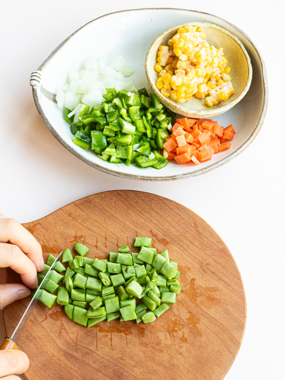 Vegetables cut into cubes about the same size as corn kernels