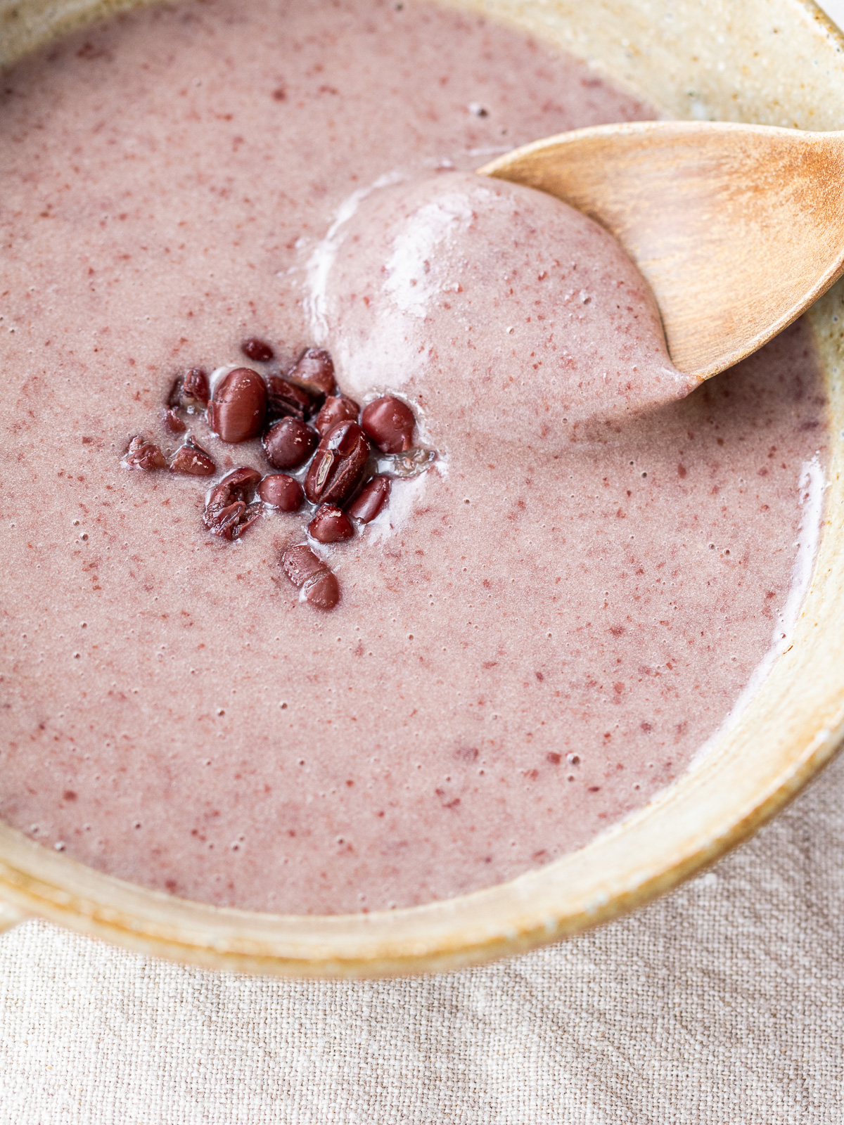 A spoonful of smooth and creamy patjuk showing its silky texture