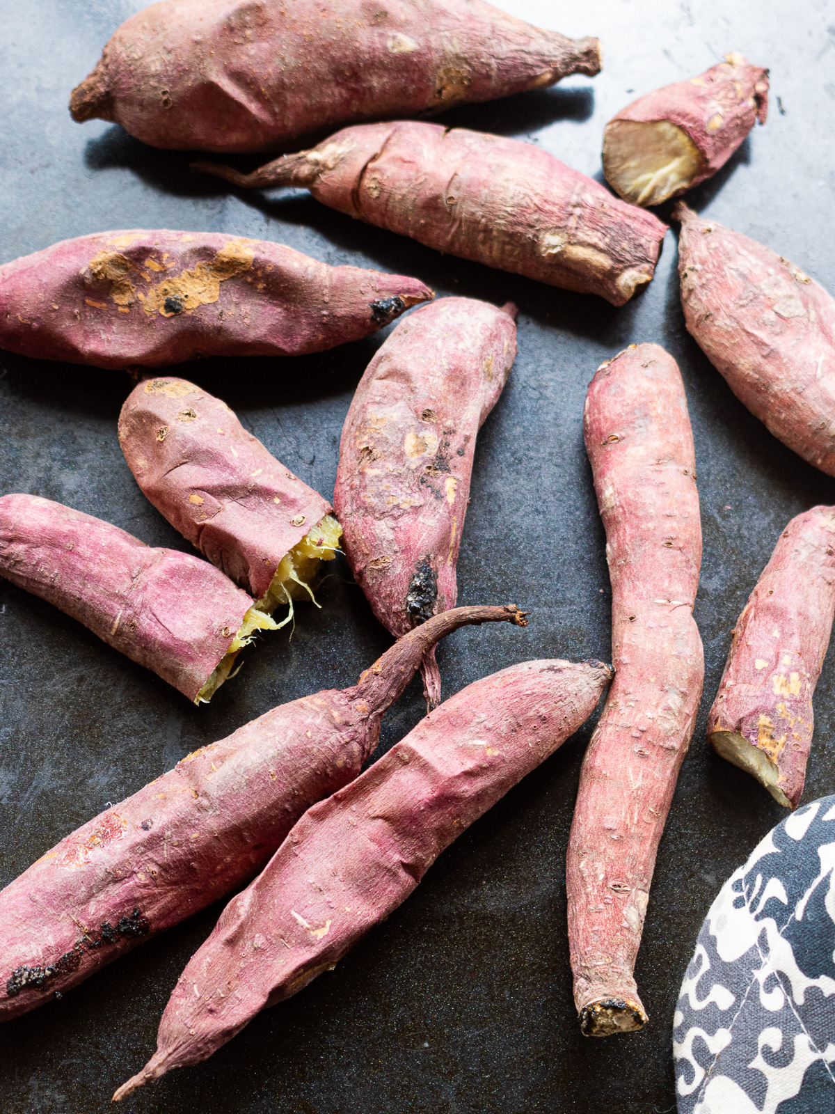Perfectly baked sweet potatoes cooling on baking sheet for kinako bliss balls