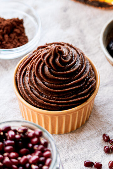 vegan chocolate frosting made with adzuki beans, piped smoothly in a bowl, coconut cream-free and soy-free
