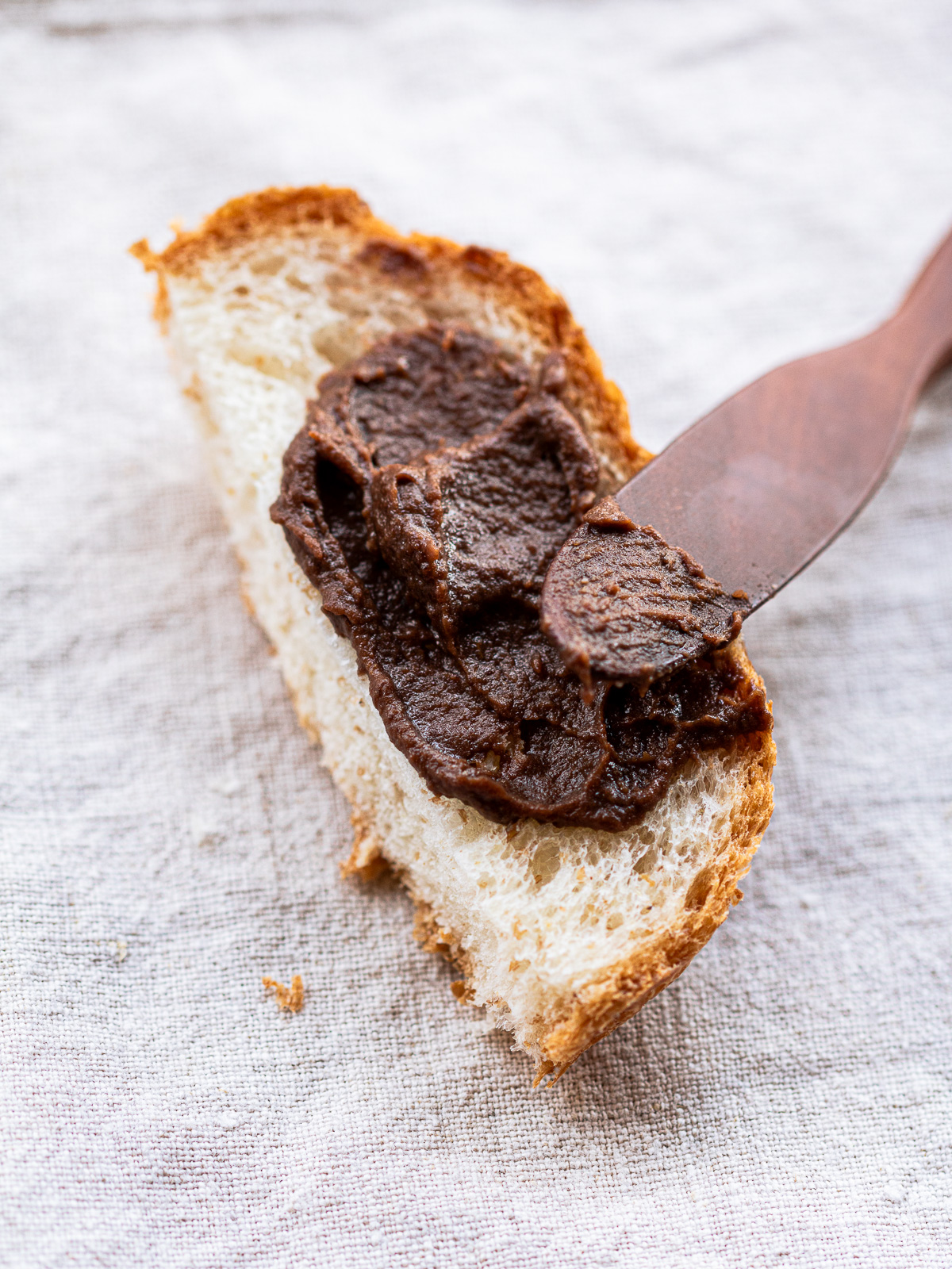 vegan chocolate frosting spread on bread, made with adzuki beans