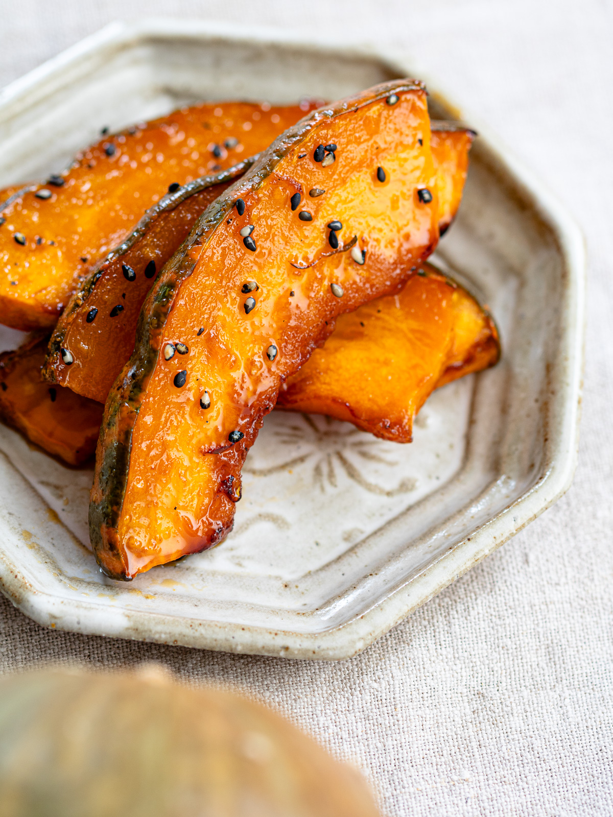 Japanese vegan candied kabocha with maple glaze and black sesame seeds