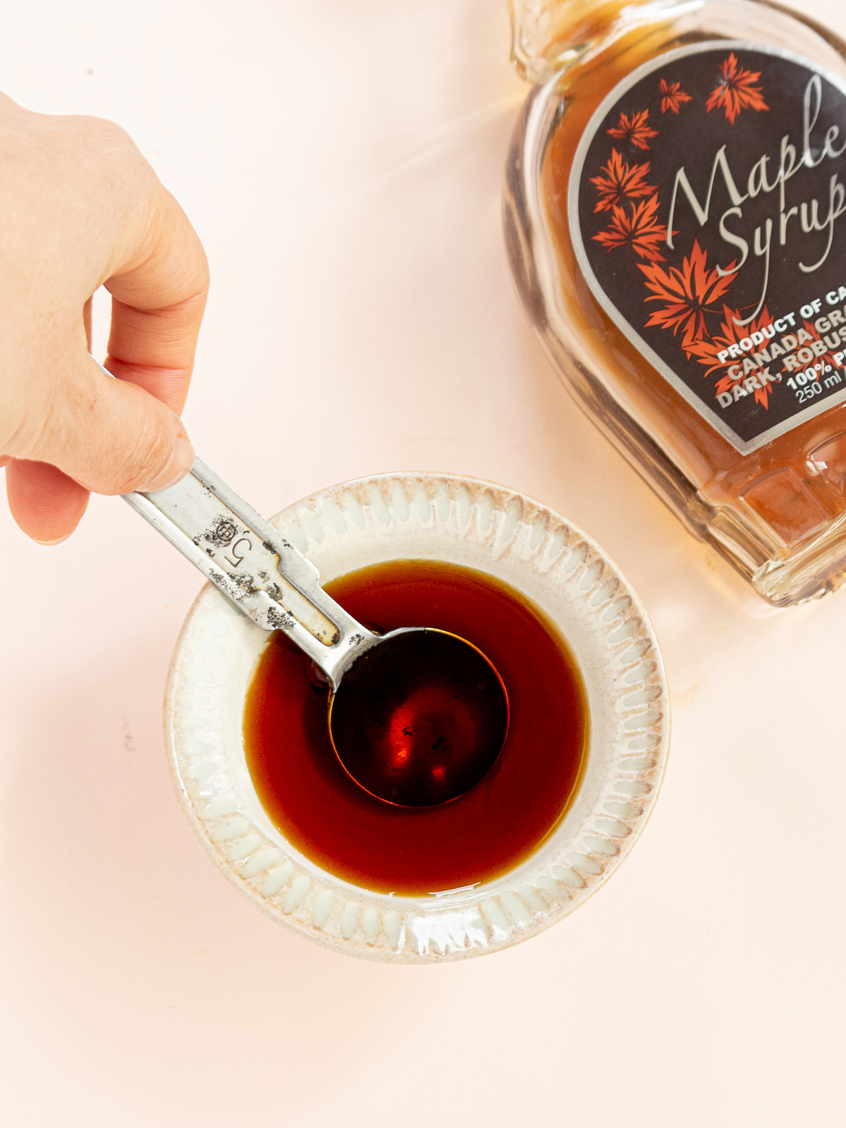 Maple-soy glaze mixed in a bowl for candied kabocha