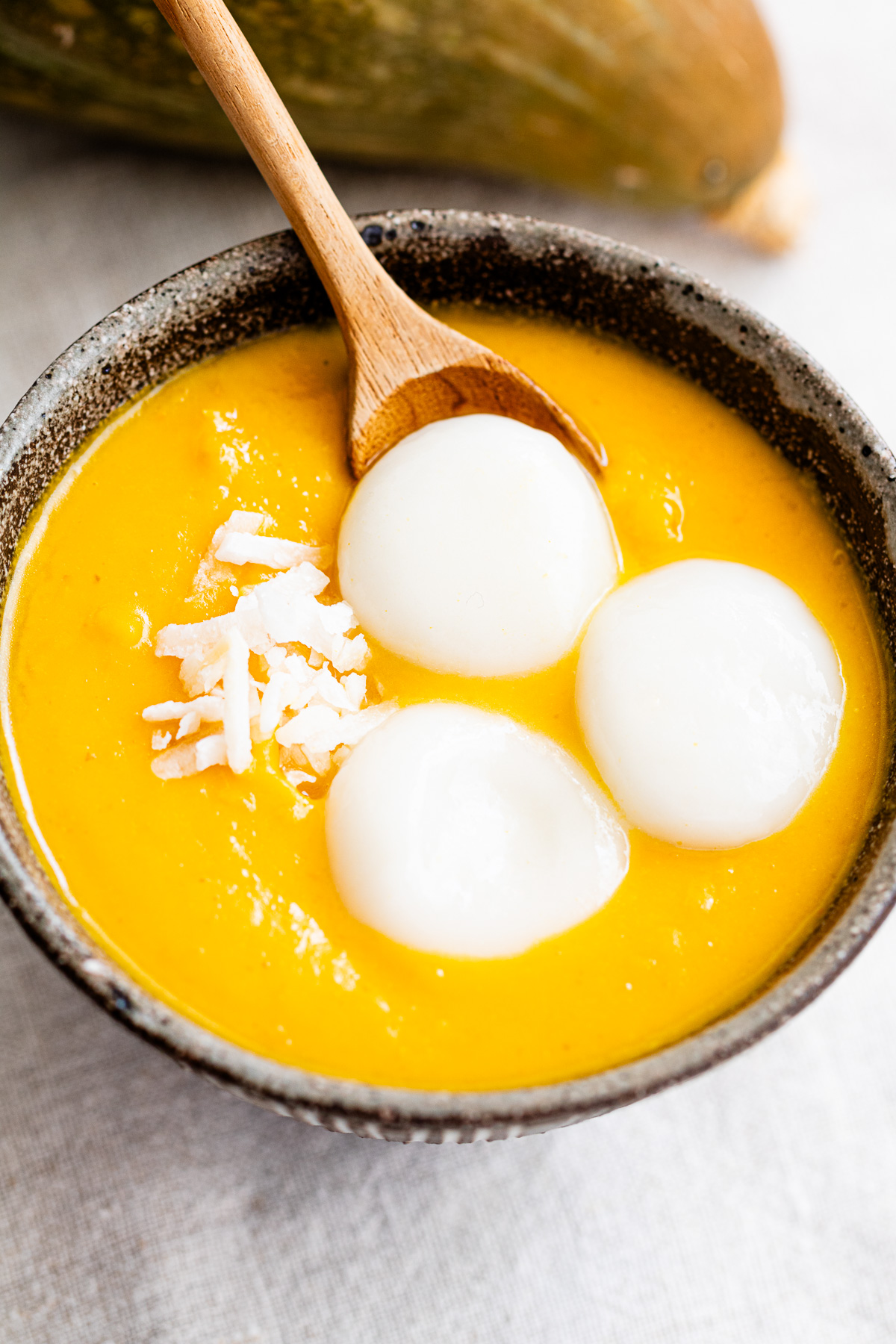 bowl of kabocha oshiruko topped with shiratama mochi