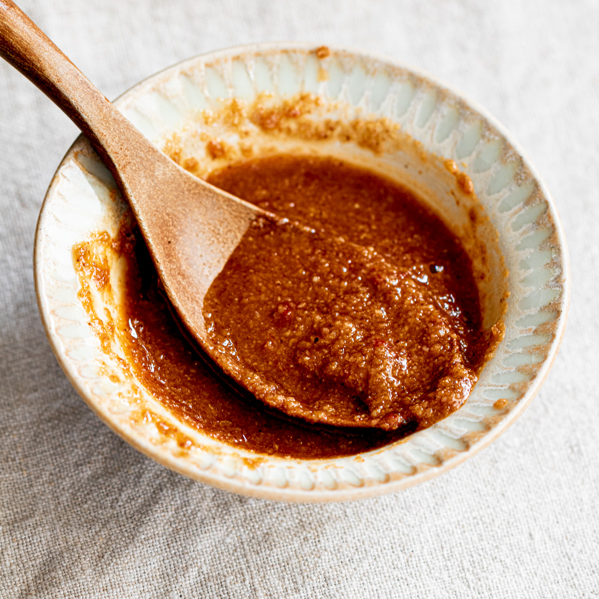 Bowl of mild vegan bibimbap sauce with soy sauce, gochujang, and sesame—perfect for Korean-style rice bowls and salads