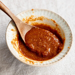 Bowl of mild vegan bibimbap sauce with soy sauce, gochujang, and sesame—perfect for Korean-style rice bowls and salads