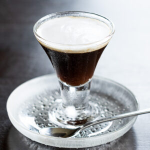 A refreshing vegan coffee jelly made with agar, served in a glass bowl. Firm texture perfect for summer desserts.