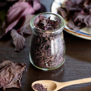 Vibrant deep red homemade low-sodium yukari furikake, perfect vegan Japanese seasoning.