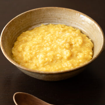 Vegan kitchari made with yellow mung beans, a gentle Indian rice porridge often enjoyed as a nourishing breakfast.