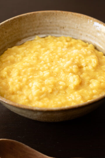 Vegan kitchari made with yellow mung beans, a gentle Indian rice porridge often enjoyed as a nourishing breakfast.