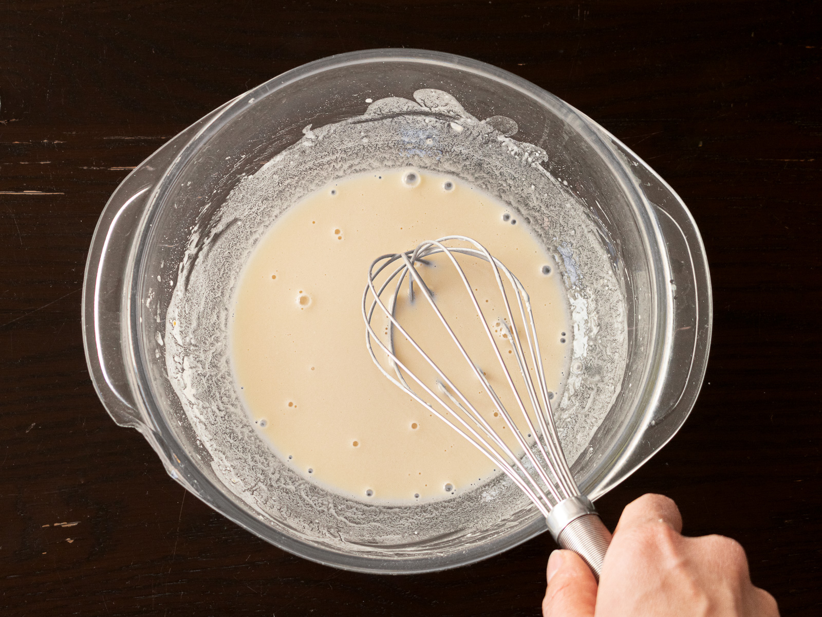Mixing cake flour, potato starch, water, soy sauce, and salt to make smooth batter for butternut squash Korean pancake