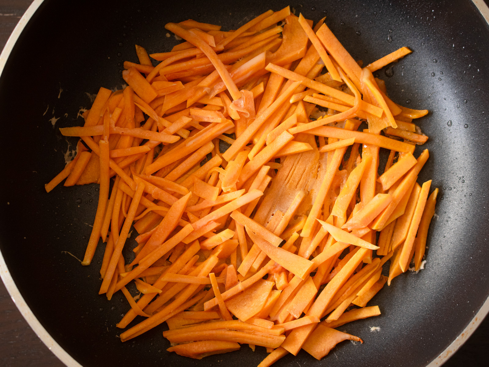 Butternut squash pancake spread thin in a frying pan, cooked slowly over low heat for the best sweetness