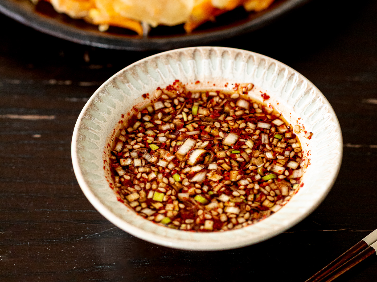 Butternut squash jeon served warm with homemade yangnyeom dipping sauce, vegan Korean pancake ready to enjoy