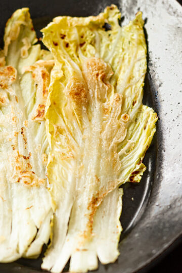 Vegan Korean cabbage pancake (Baechu Jeon) on a plate, golden and crispy, ready to serve as a cabbage side dish