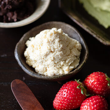 Tofu whipped cream alongside matcha crepe ingredients and strawberries