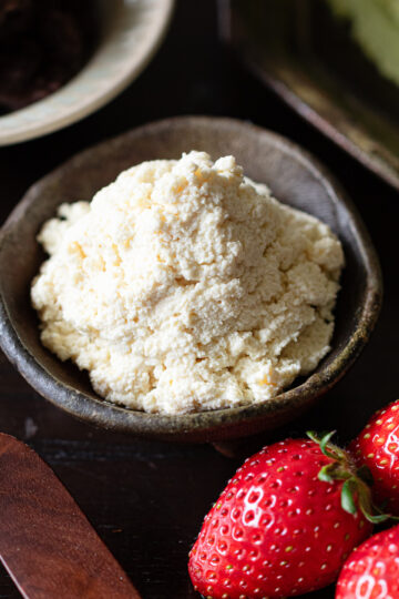 Tofu whipped cream alongside matcha crepe ingredients and strawberries