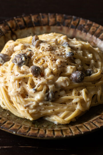 Vegan carbonara with chickpea flour and soy milk, topped with black pepper