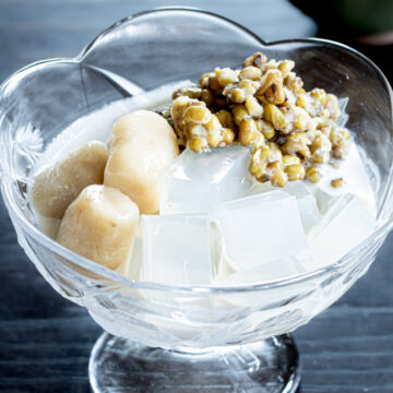 A healthy plant-based dessert of mung beans and agar jelly, served with coconut milk sauce