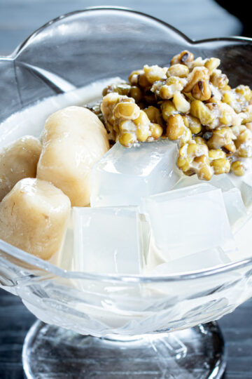 A healthy plant-based dessert of mung beans and agar jelly, served with coconut milk sauce