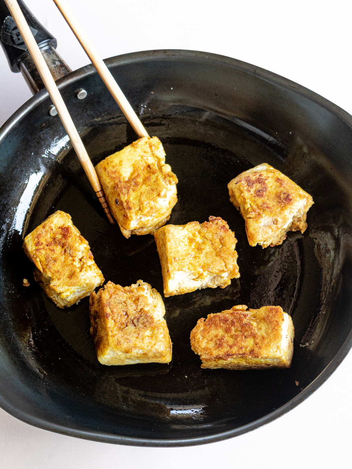 Deep-fried frozen tofu pan-fried over low heat until golden brown