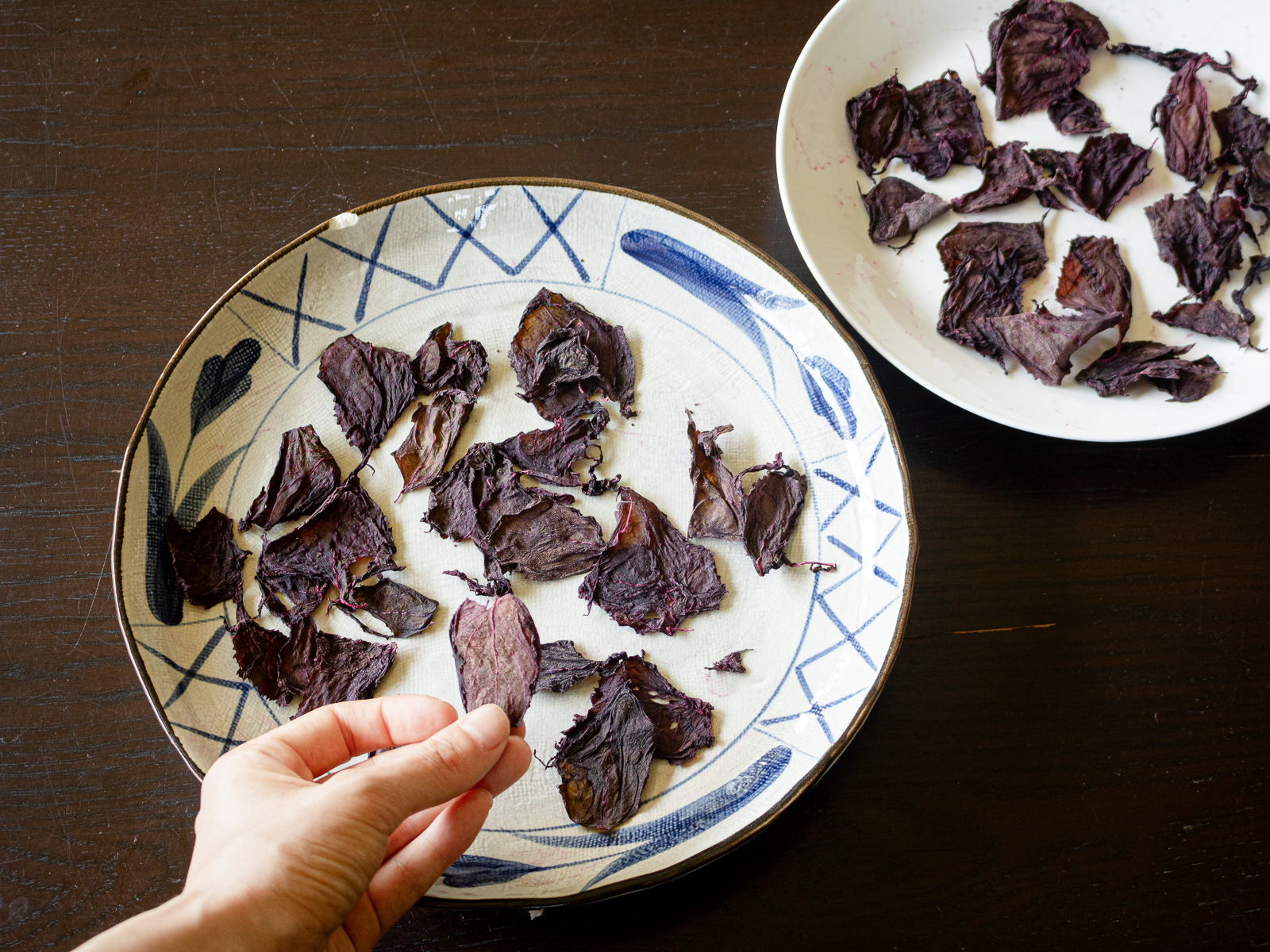 Red shiso dried to a crisp in the shade on a sunny day, preserving its gentle color and aroma.