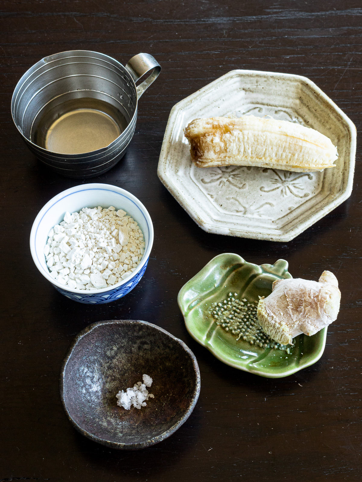 Ingredients for vegan banana shiratama dumplings with ginger syrup — ripe banana, shiratamako, ginger syrup, salt and fresh ginger.