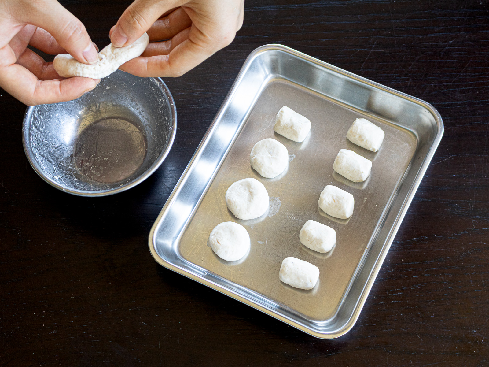 Shaping banana shiratama dough into small round dumplings by hand.