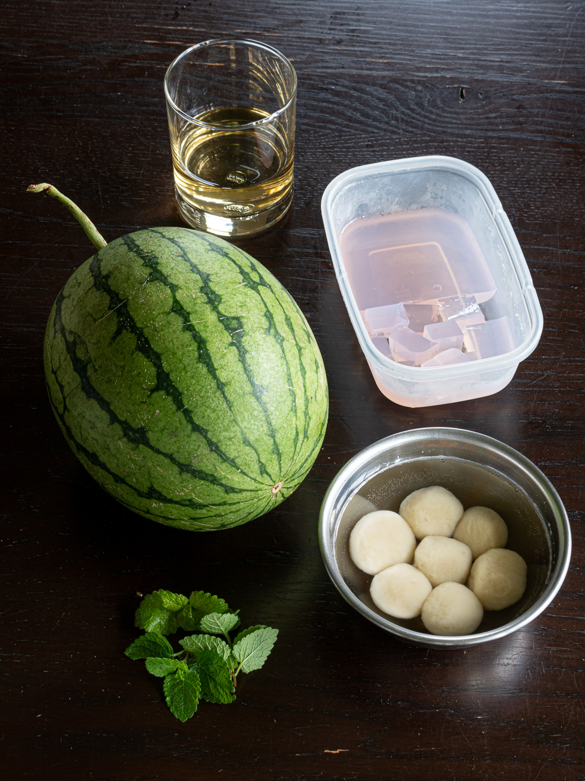 Ingredients for watermelon fruit punch: small seedless watermelon (or temari if available), chewy banana mochi, pink agar jelly (tinted with mallow flowers), simple syrup, fresh mint