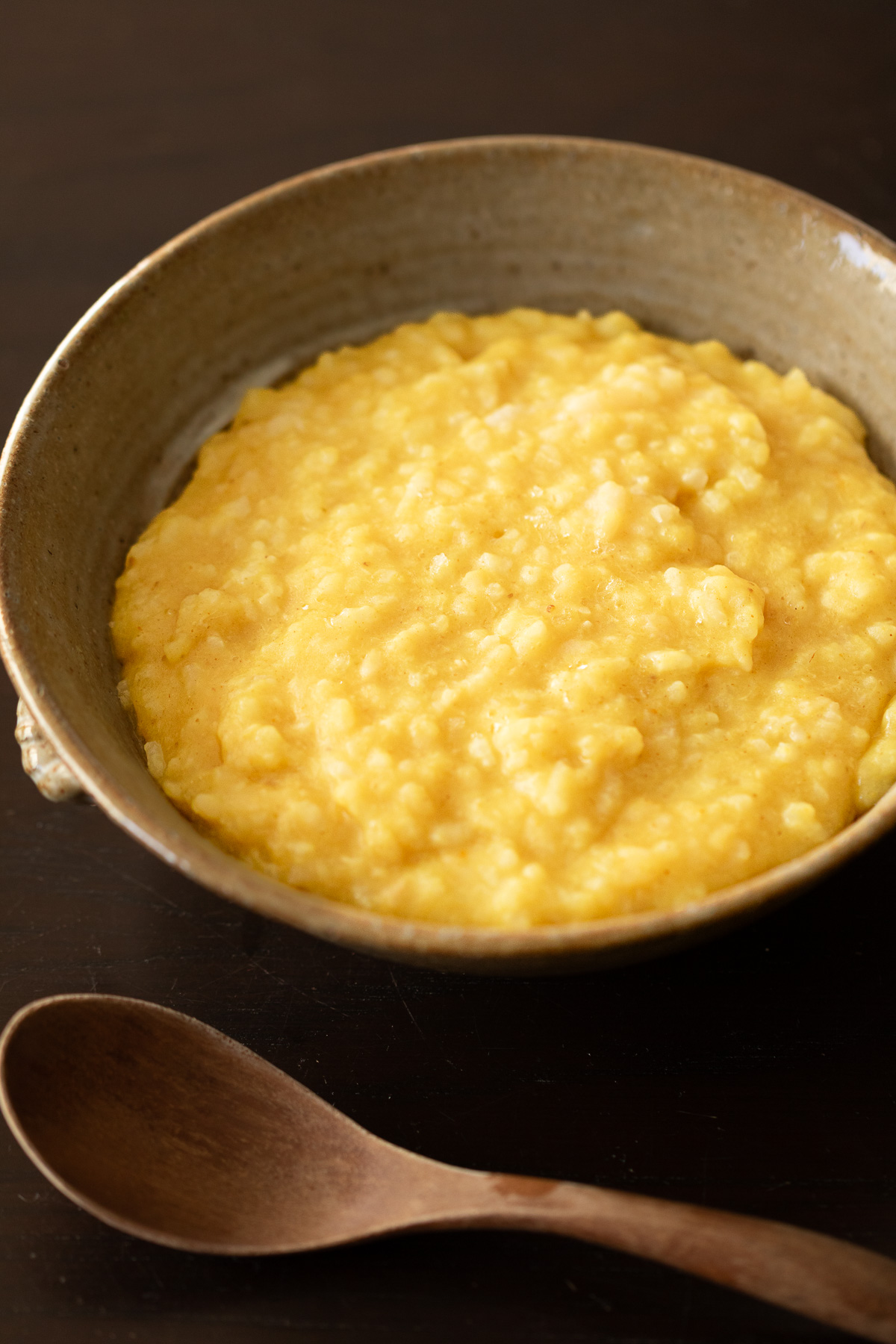 Gentle yellow kitchari, a soothing Indian spiced rice and mung bean porridge.