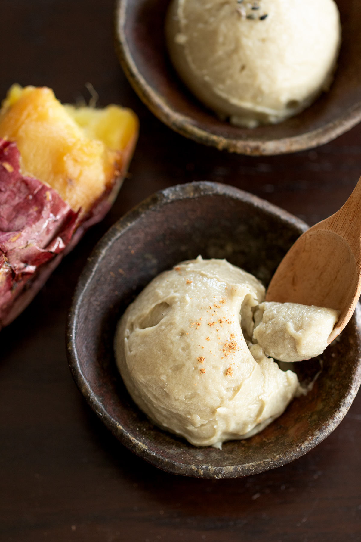 Spoonful of creamy vegan yakiimo ice cream showing soft, mochi-like texture