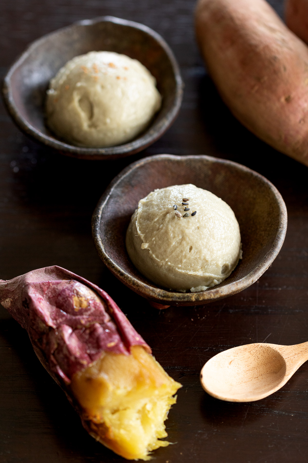 soft, mochi-like texture Vegan sweet potato ice cream topped with black sesame seeds and cinnamon powder