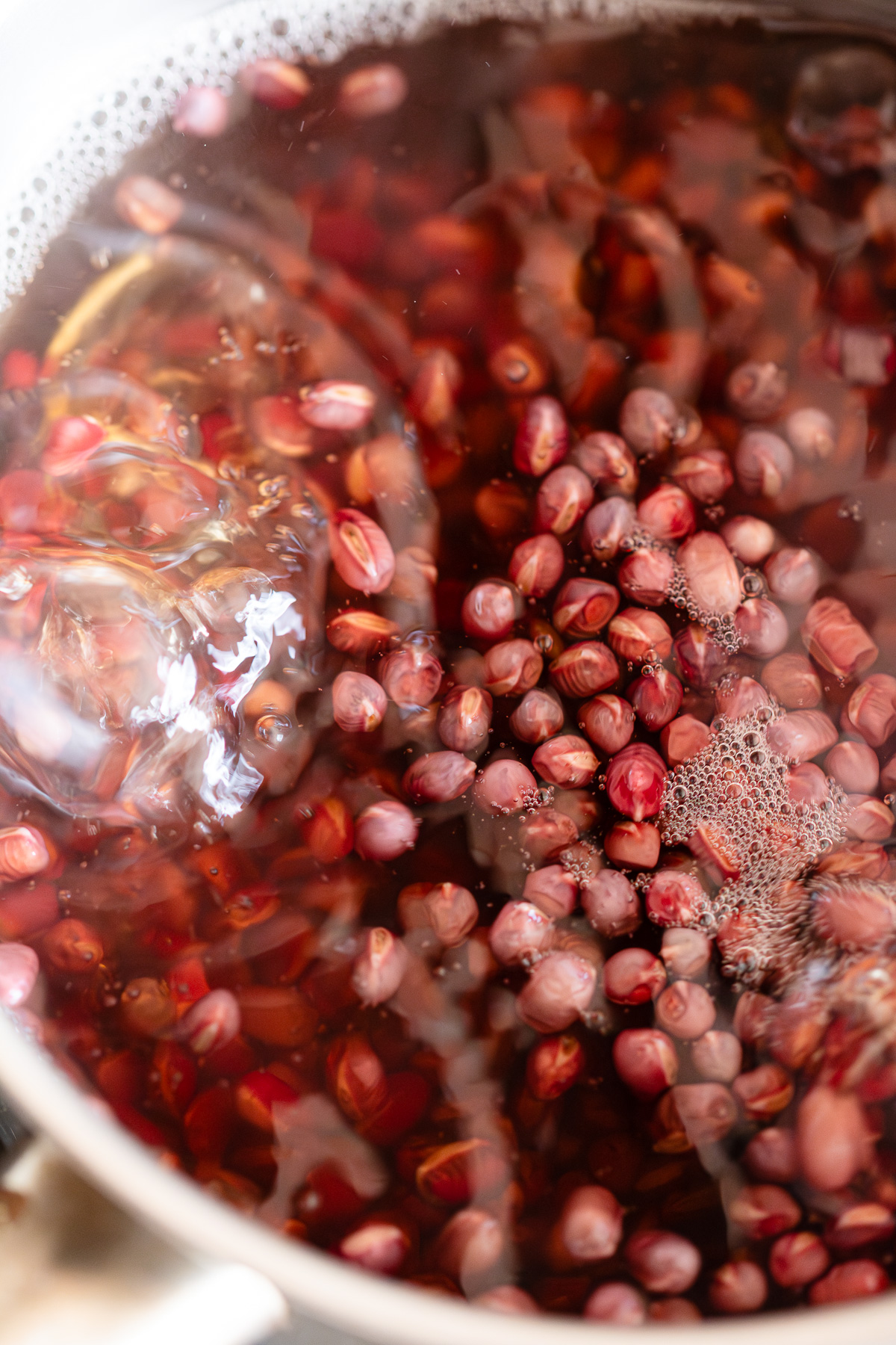 Adzuki beans boiling over medium heat during parboiling