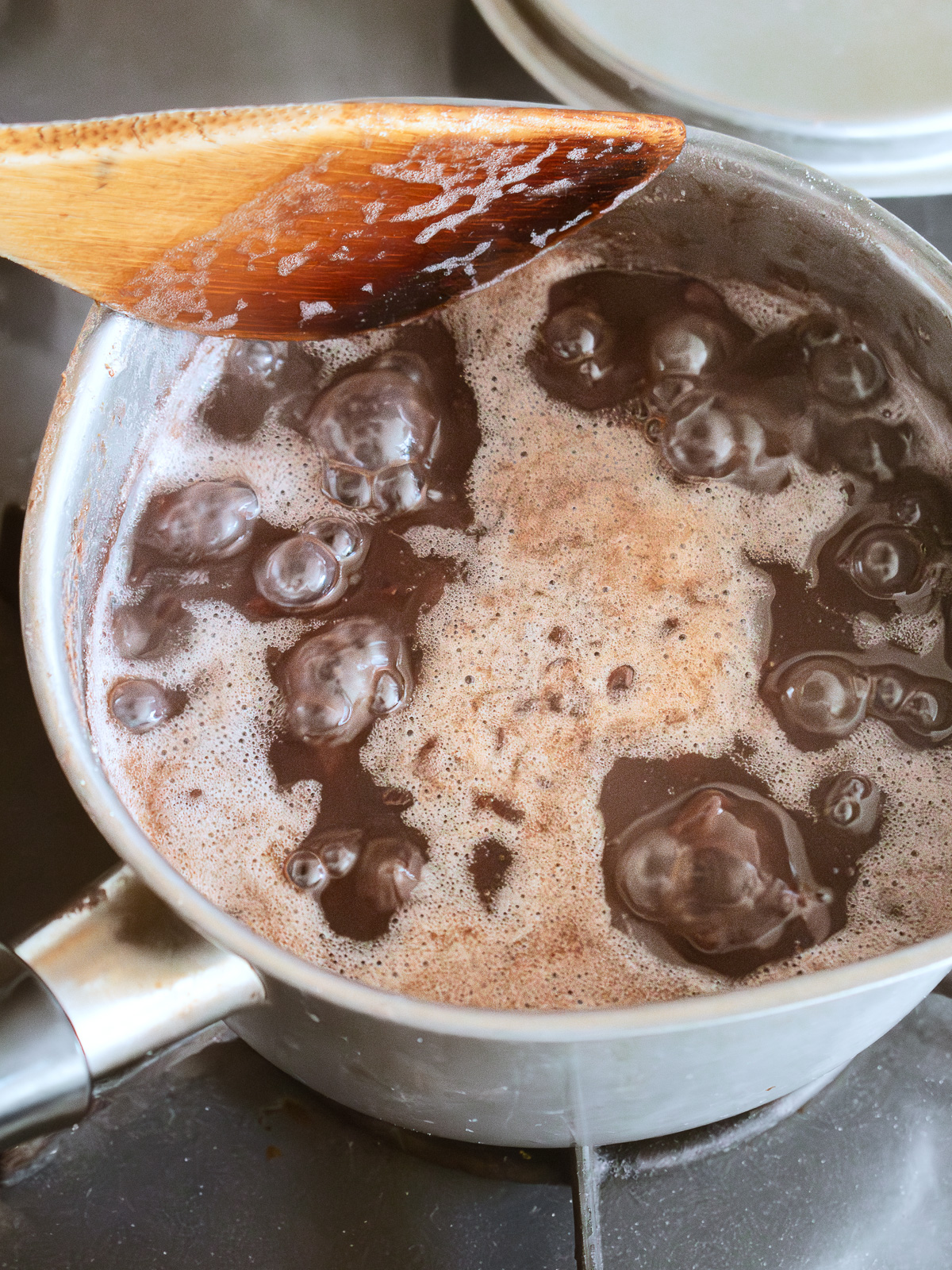 Red bean paste beginning to bubble over heat