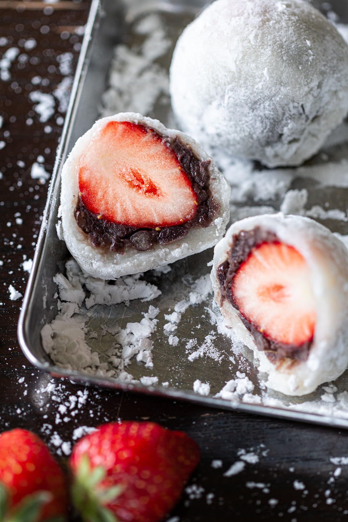Homemade ichigo daifuku arranged on a tray